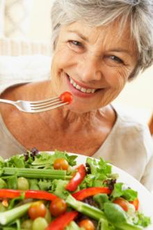 mature woman eating salad.jpg